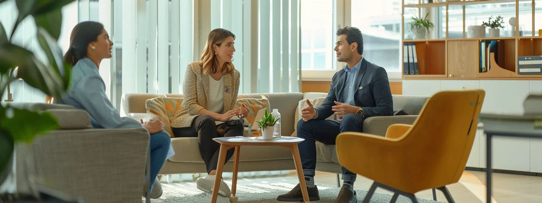 a couple meeting with a mortgage lender in a modern office setting.