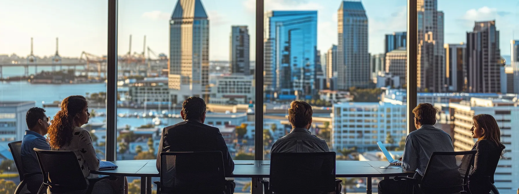 a group of people meeting with mortgage lenders in an office overlooking the san diego skyline.