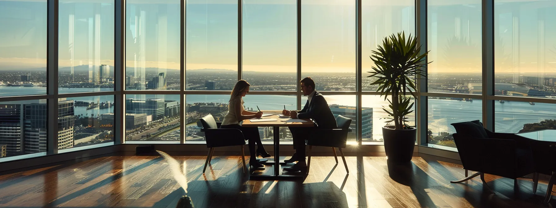 a couple signing paperwork at a sleek, modern real estate office with a view of downtown san diego through floor-to-ceiling windows.