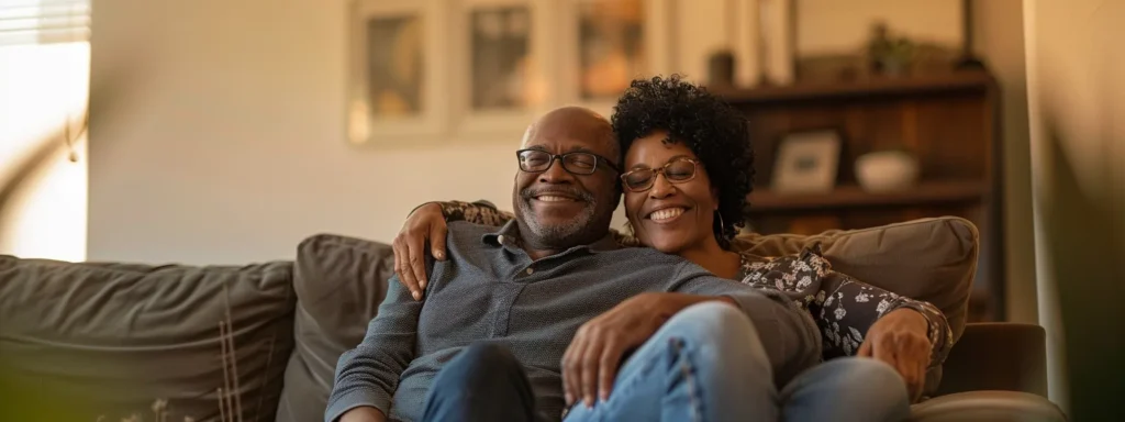 a couple sitting together in their newly refinanced home in san diego, looking happy and relaxed.