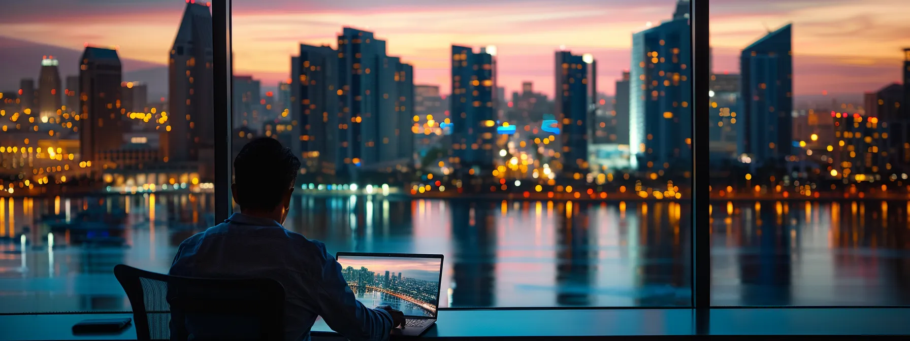 a person analyzing mortgage rates on a laptop with a view of san diego's skyline in the background. a person analyzing mortgage rates on a laptop with a view of san diego's skyline in the background.
